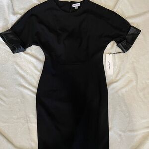 Black Calvin Klein dress with pleather cuff sleeve detail